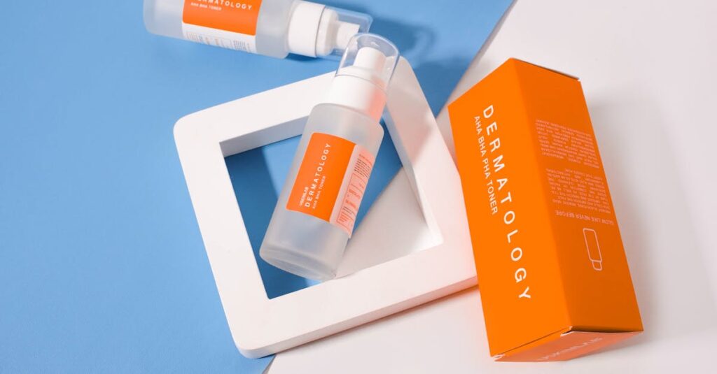 Stylish presentation of dermatology skincare products with orange packaging on a geometric background.