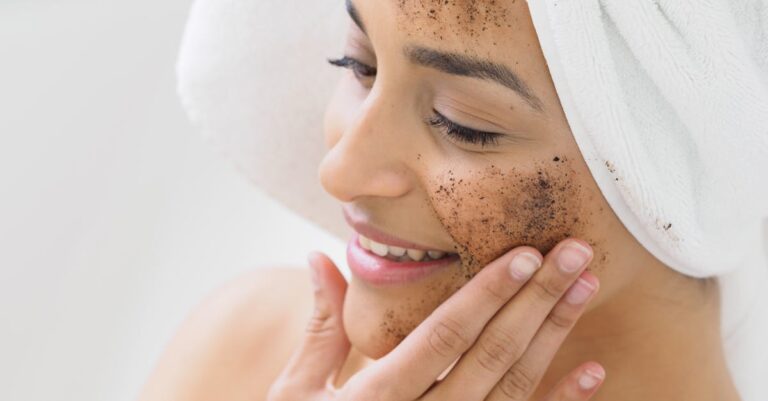Woman enjoying skincare routine with coffee scrub exfoliation for healthy skin.